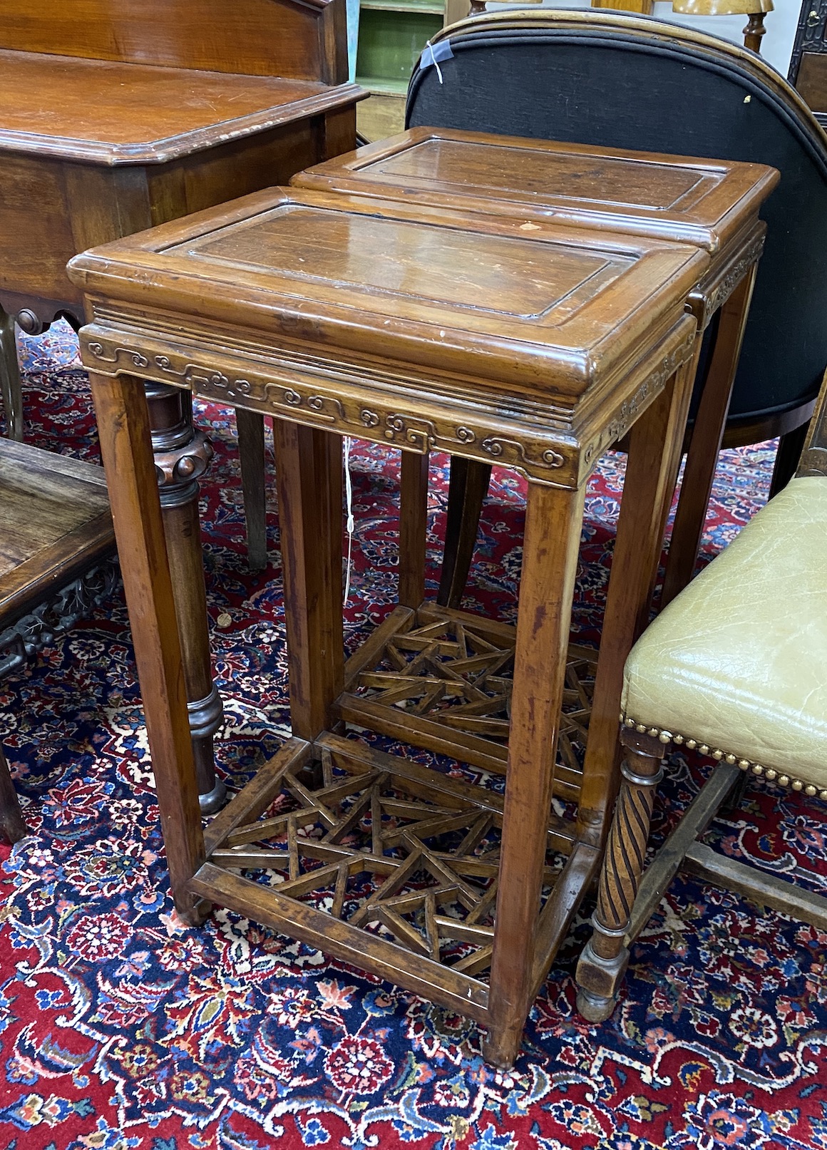 A pair of Chinese hardwood rectangular tables, width 42cm, depth 29cm, height 76cm